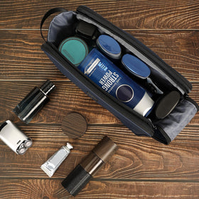 ZEEMO Travel Toiletry Bag packed in a suitcase