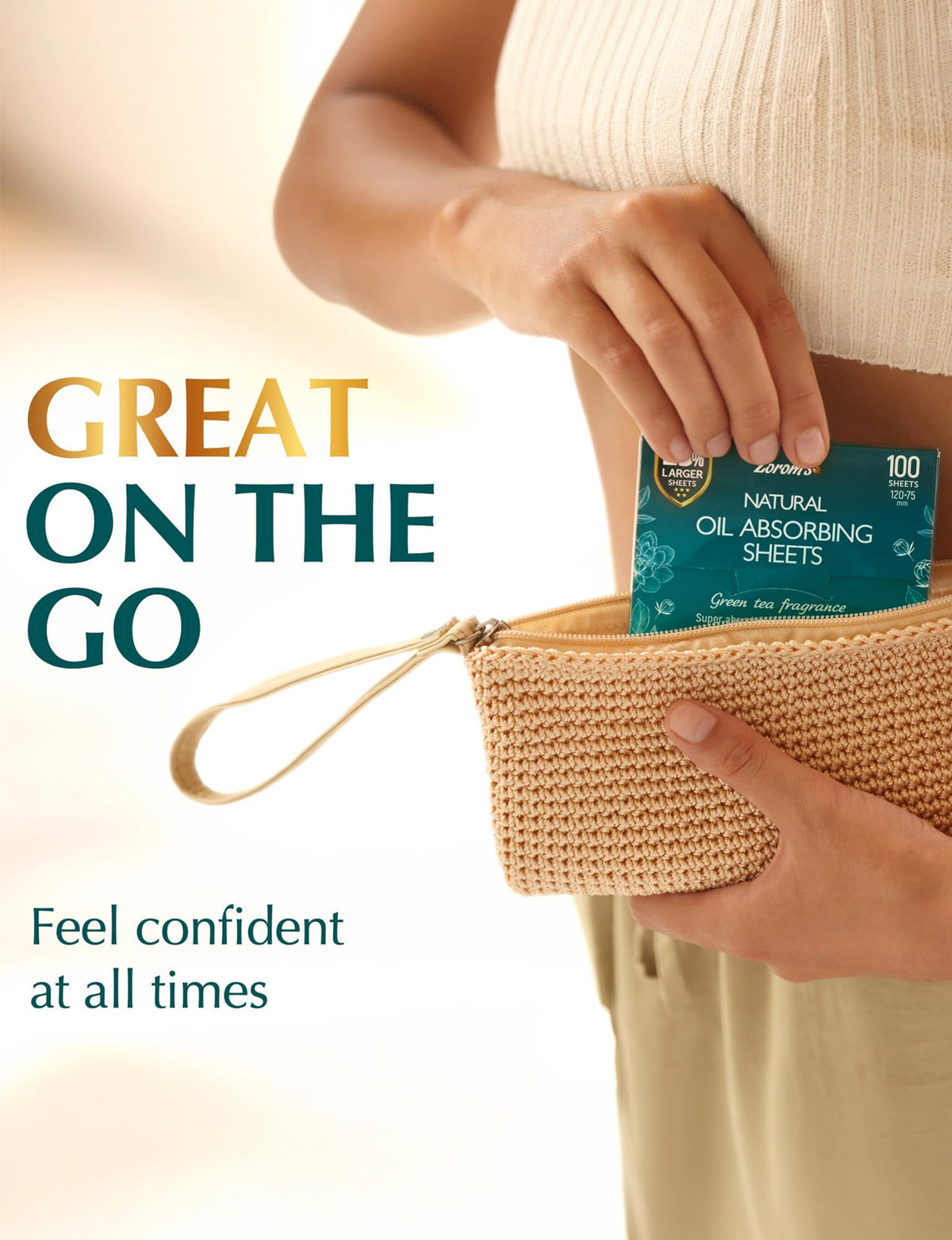 ZOROM'S XL Oil Blotting Sheets with a hand holding one sheet